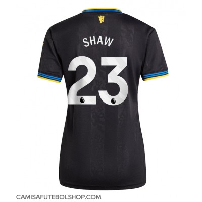 Camisa de time de futebol Manchester United Luke Shaw #23 Replicas 3º Equipamento Feminina 2025-26 Manga Curta Camisa de time de futebol Manchester United Luke Shaw #23 Replicas 3º Equipamento Feminina 2025-26 Manga Curta